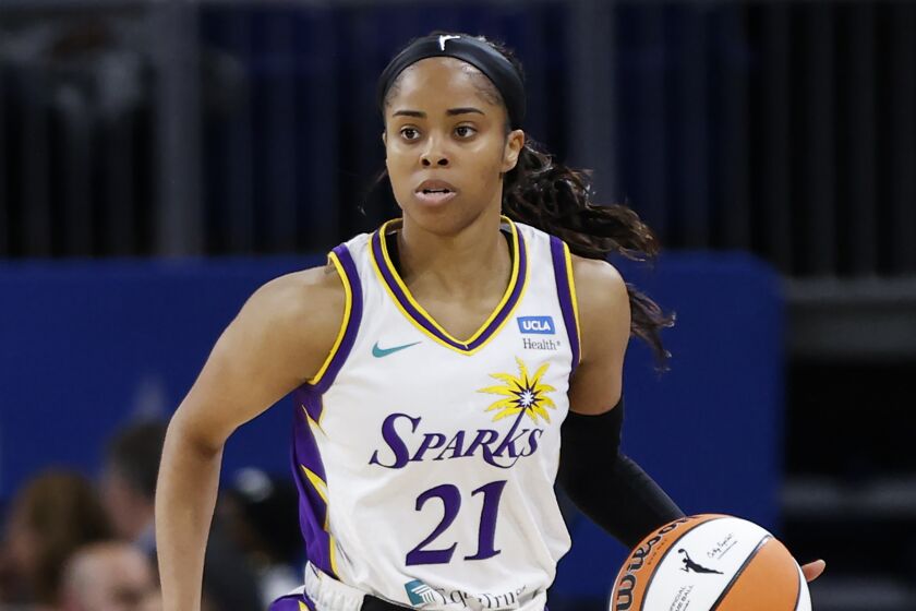 Los Angeles Sparks guard Jordin Canada brings the ball up court against the Chicago Sky during the first half of the WNBA basketball game, Friday, May 6, 2022, in Chicago. (AP Photo/Kamil Krzaczynski)