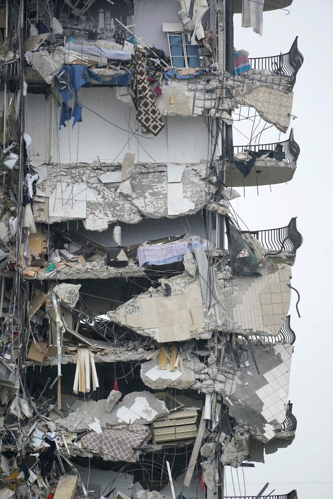 Part of a building is shown after a partial collapse