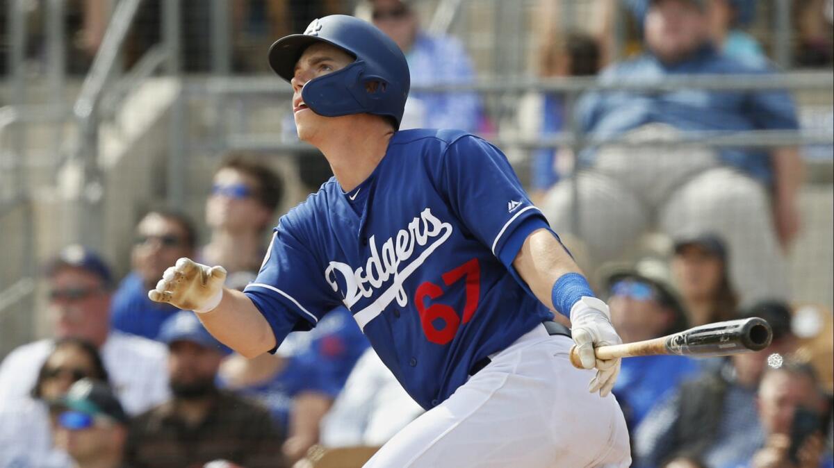 Catcher Will Smith, hitting a fly ball during a spring-training game in March, will make his major league debut with the Dodgers on Tuesday.
