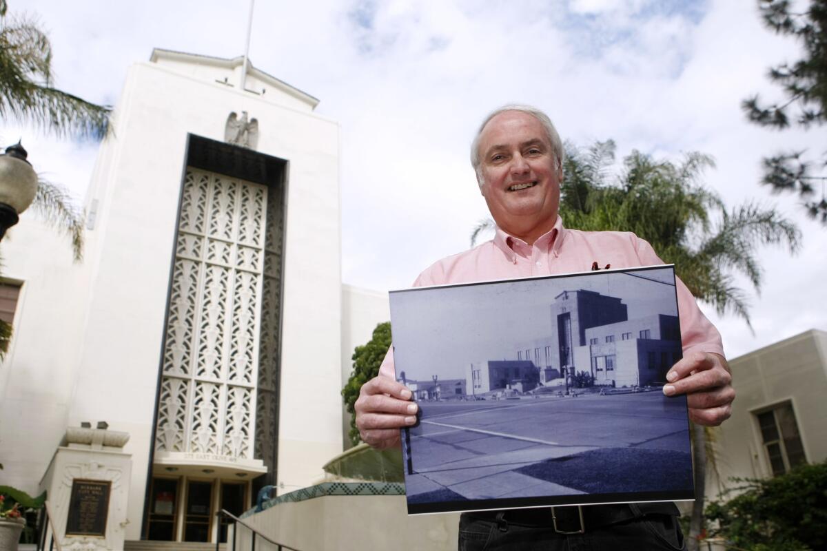 While standing outside of Burbank City Hall, Mike McDaniel, who wrote a book called "Lost Burbank" with his friend Wes Clark, shows a vintage photo of the building.