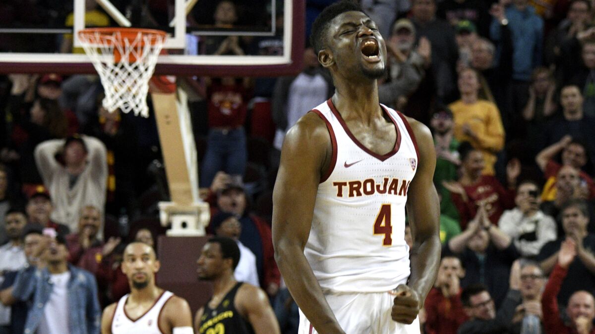 USC forward Chimezie Metu reacts after making a last-second shot against Oregon to give the Trojans a win on Thursday, Feb. 15, 2018.