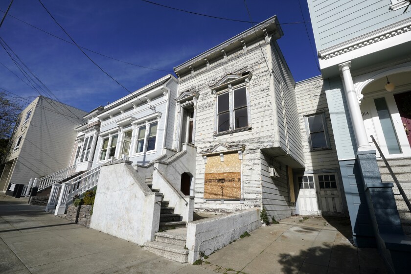 A recently sold Victorian home is shown in San Francisco, Friday, Jan. 14, 2022. The decaying, 122-year-old Victorian marketed as "the worst house on the best block" of San Francisco recently sold for nearly $2 million — an eye-catching price that the realtor said was the outcome of overbidding in an auction. (AP Photo/Jeff Chiu)