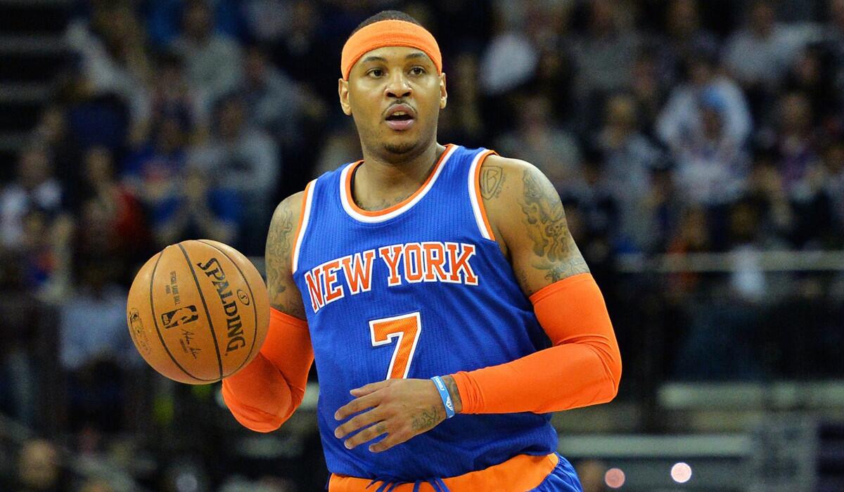 The New York Knicks' Carmelo Anthony dribbles the ball during the 2015 NBA global game between Milwaukee Bucks and Knicks at the O2 Arena in London.