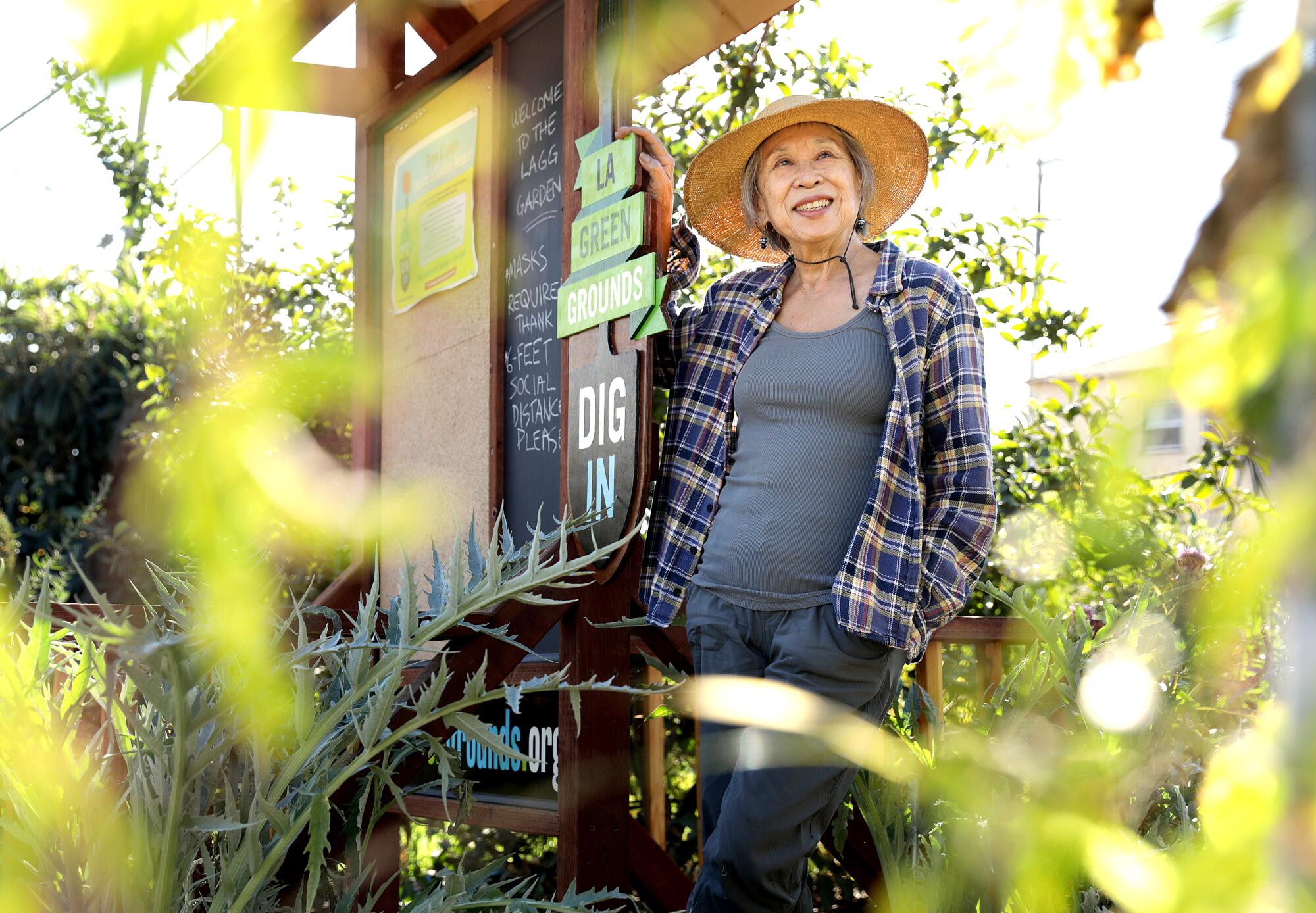 Florence Nishida wears a straw hat at L.A. Green Grounds Garden.