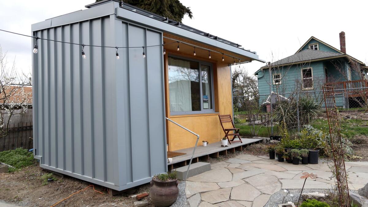 A 125-square-foot tiny house belonging to a formerly homeless man sits in a Seattle backyard.