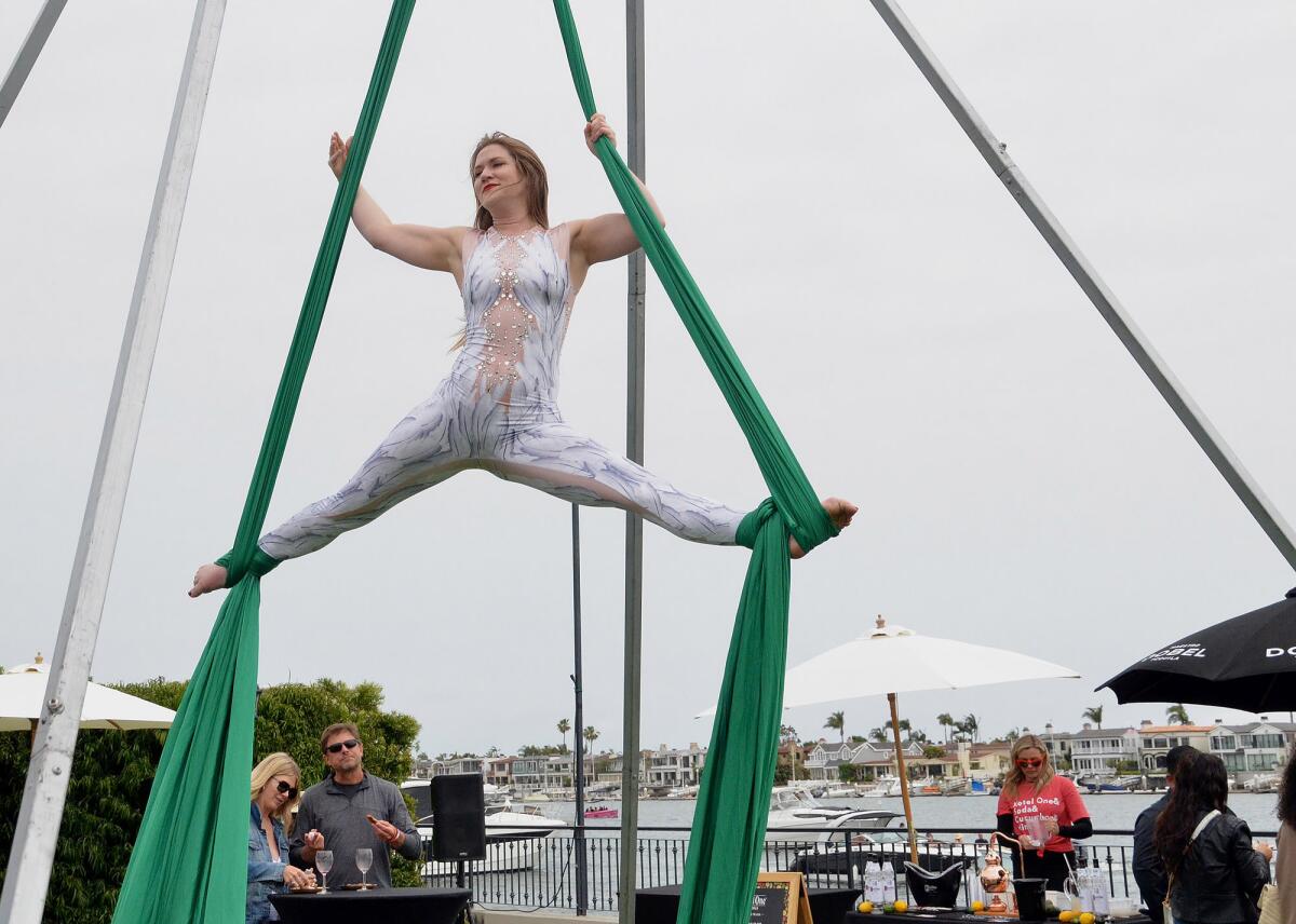 Elaine Brackin, Cirque Mirage aerial artist using suspended silks.