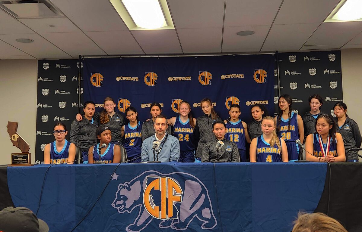 The Marina High girls' basketball team fields questions following the CIF State Division V championship game in Sacramento.