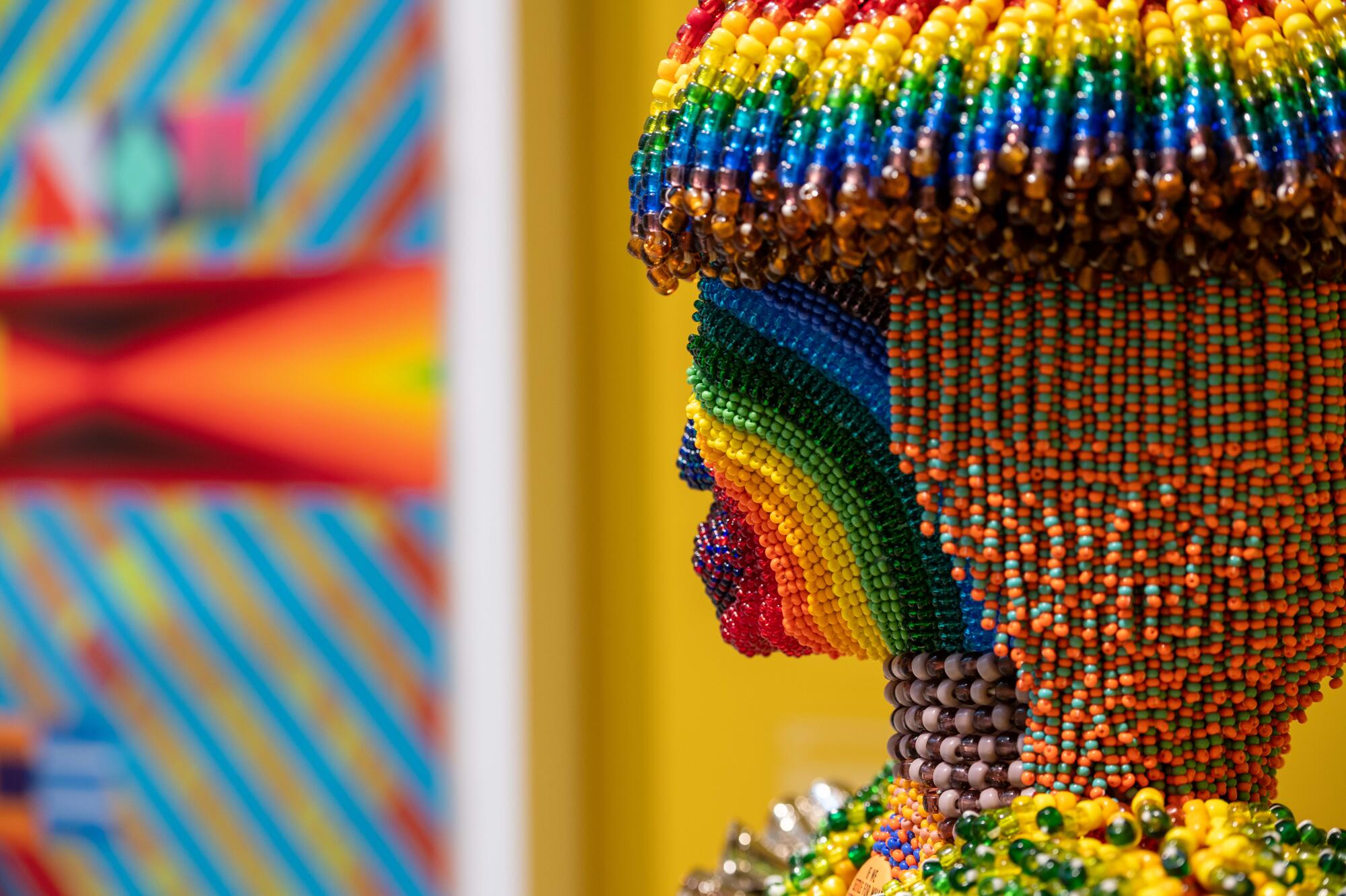 A rainbow of beads form a dreadlocked bust, one of Gibson's works on view at the Venice Bienniale.
