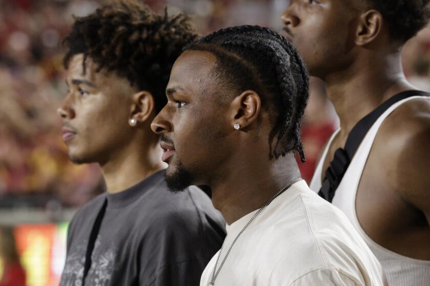 LOS ANGELES, CA - AUGUST 26: Bronny James watches the season opener against San Jose State at the Los Angeles Memorial Coliseum in Los Angeles, CA on Saturday, Aug. 26, 2023. (Myung J. Chun / Los Angeles Times)