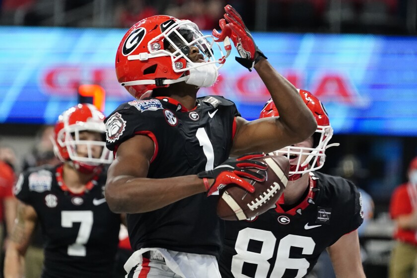 Georgia receiver George Pickens celebrates his touchdown catch against Cincinnati during the first half of the Peach Bowl.
