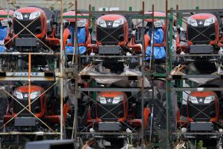 Kubota tractors are stored in Uniontown, Pa., Friday, June 9, 2023. On Thursday, the Commerce Department issues its first of three estimates of how the U.S. economy performed in the second quarter of 2023. (AP Photo/Gene J. Puskar)