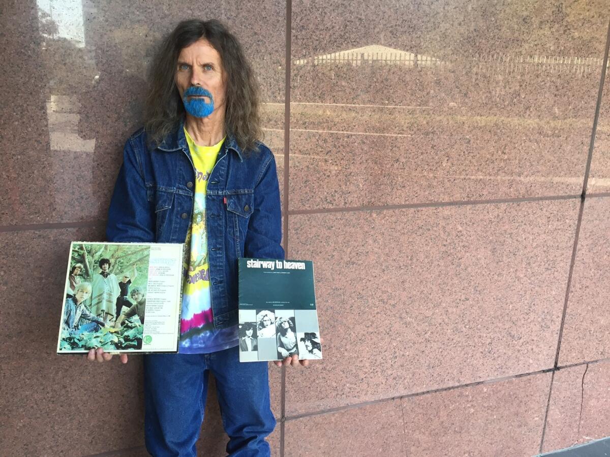 Blue Boy, 65, shows his copy of Spirit's 1968 debut album in his right hand, and the sheet music for Led Zeppelin's "Stairway to Heaven" in his left. He has attended every day of the Zeppelin-Spirit copyright infringement trial underway in Los Angeles.