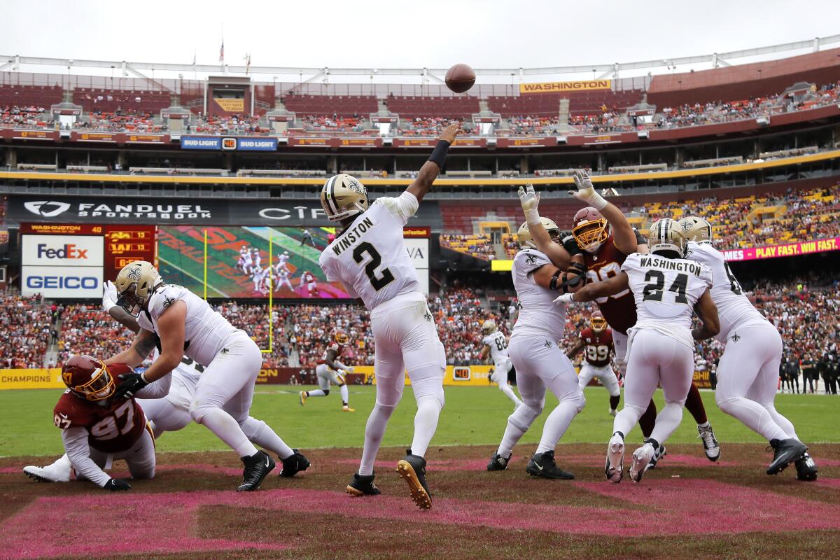 New Orleans Saints quarterback Jameis Winston (2) throws a pass in the first half of an NFL football game against the Washington Football Team, Sunday, Oct. 10, 2021, in Landover, Md. (AP Photo/Julio Cortez)