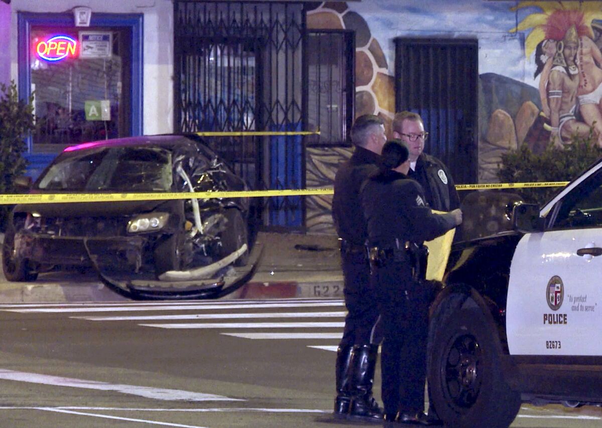 An investigation after a police pursuit ended in a crash in South Los Angeles, sending three people to a hospital.