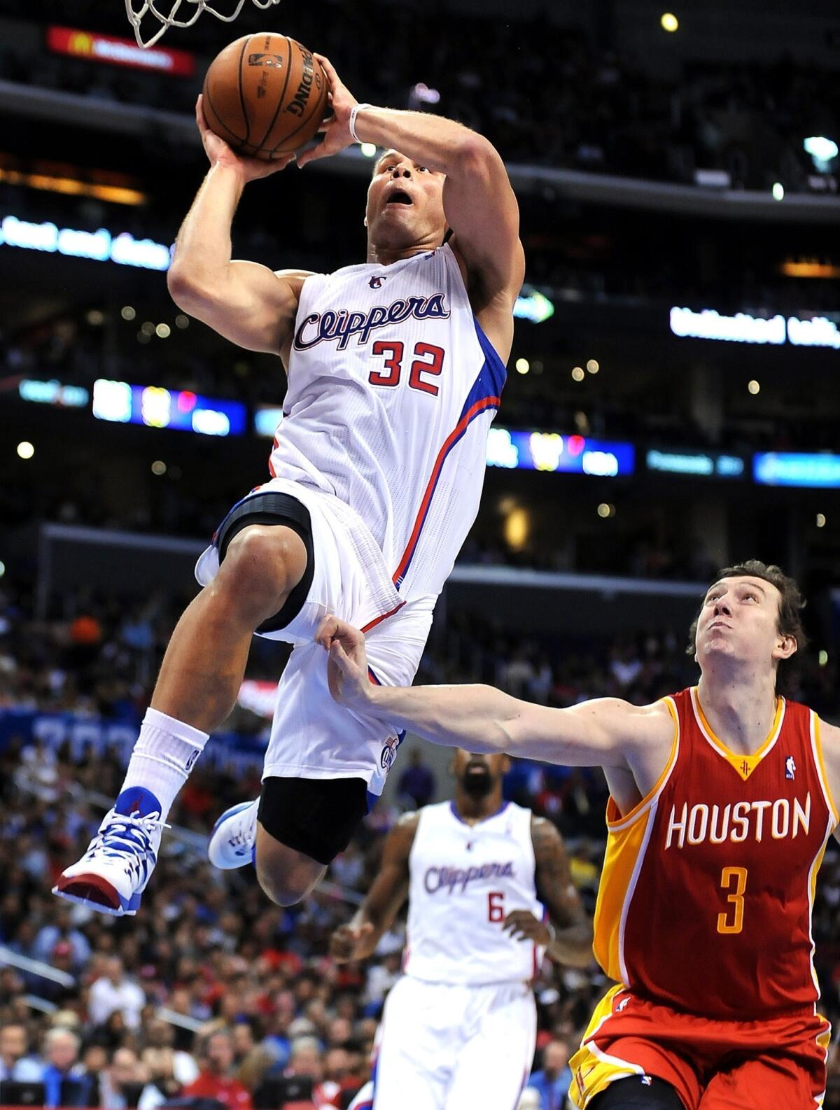 Clippers forward Blake Griffin dunks during the first half of Monday's game against the Rockets.