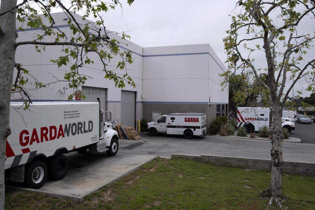 Armored trucks parked outside a GardaWorld facility in Sylmar