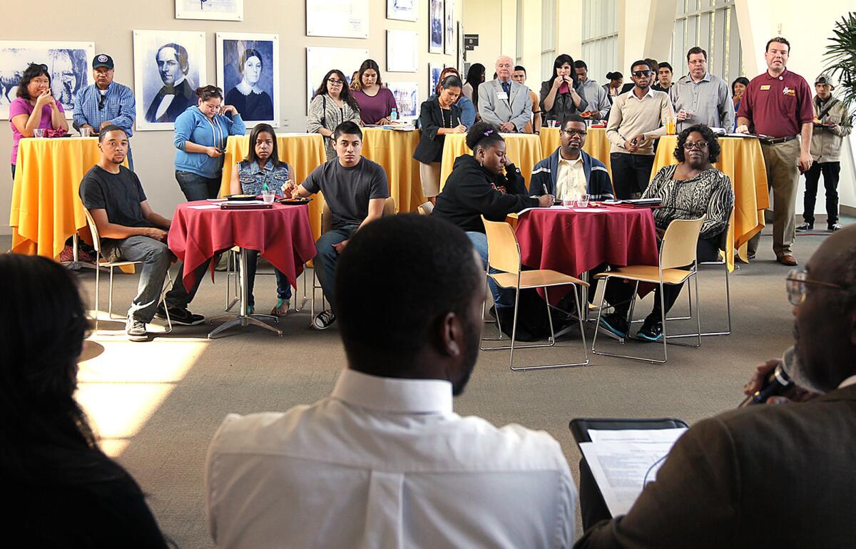 Concerned students gather to listen to a panel of leaders and school administrators, including Cal State Dominguez Hills President Dr. Willie J. Hagan, right, discuss plans to increase fees despite an improving budget outlook and pledges to keep tuition stable. Students were expected to protest so-called "student success fees" Wednesday.