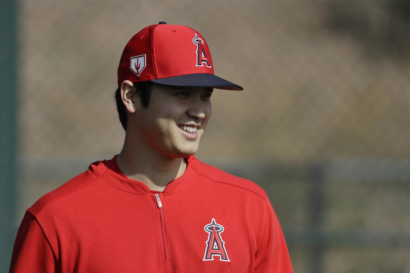 Los Angeles Angels' Shohei Ohtani, of Japan, walks on the practice field at their spring baseball training facility in Tempe, Ariz., Friday, Feb. 15, 2019. (AP Photo/Chris Carlson)