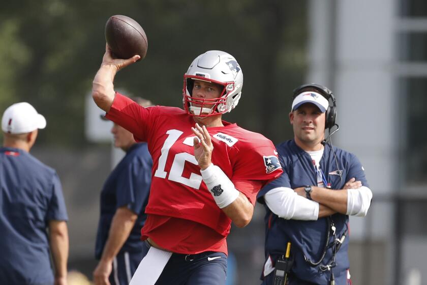 New England Patriots quarterback Tom Brady throws at the Detroit Lions NFL football training facility, Tuesday, Aug. 6, 2019, in Allen Park, Mich. (AP Photo/Carlos Osorio)