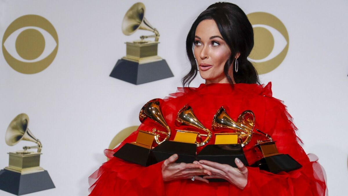 Kacey Musgraves holds her four awards -- including for album of the year for "Golden Hour"-- at the 61st GRAMMY Awards. Last year the show was roundly critized for leaving women out of the top categories.