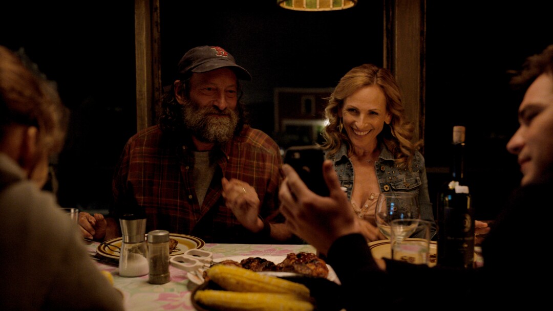 People sit around a dinner table
