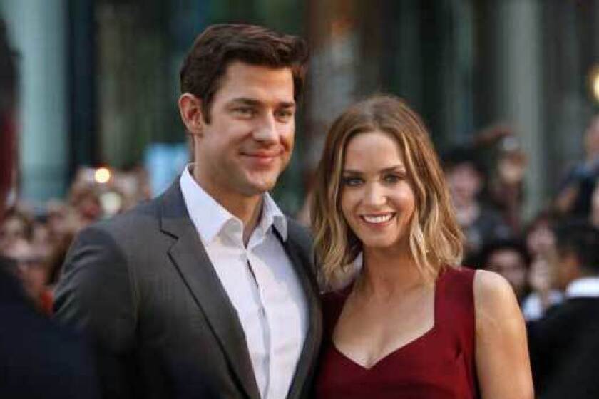 John Krasinski and Emily Blunt attend the premier of her film "Looper," a futuristic action thriller, at the Toronto Film Festival in early September.