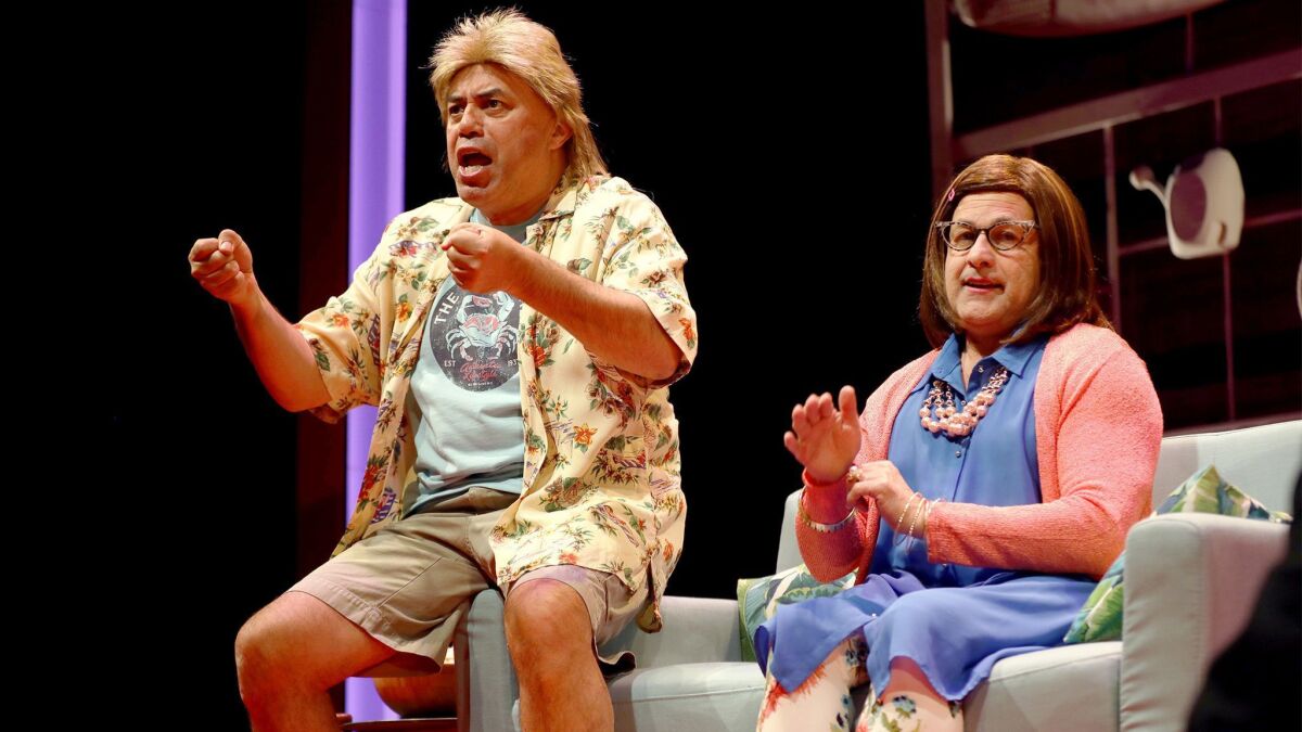 Herbert Siguenza, left, and Ricardo Salinas of Culture Clash play a blue-collar Miami couple in one of the sketches in "Culture Clash (Still) in America."