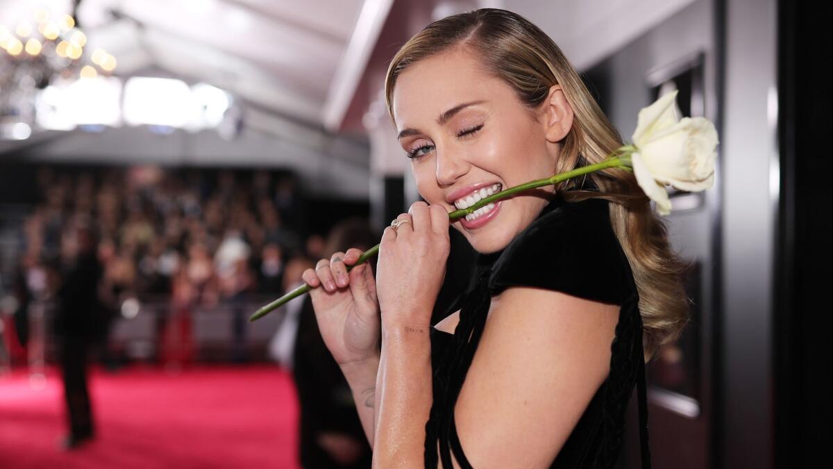 Miley Cyrus is proving she’s all grown up. There was nothing wild about the singer’s red-carpet look, which showcased a classic and fresh approach to clean skin, barely-there eye makeup and a natural lip.
