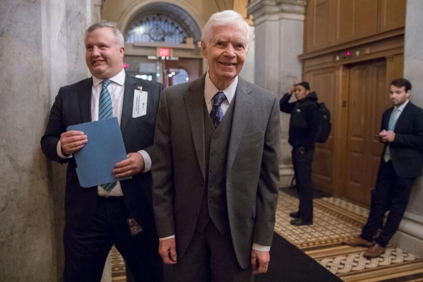 FILE - In this Jan. 10, 2018, file photo Sen. Thad Cochran, R-Miss., returns to the Capitol for a vote in Washington. Cochran tells The Associated Press he will resign April 1 because of health problems. The 80-year-old has had Cochran stayed home for a month last fall with urinary tract infections, returning to Washington in October to give Republicans the majority they needed to pass a budget plan. (AP Photo/J. Scott Applewhite, File)