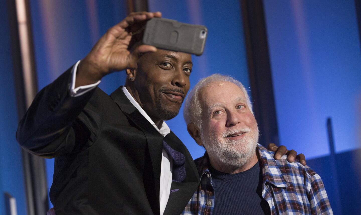 Comedian and "Greatest Hits" co-host Arsenio Hall snaps a pic with executive producer Ken Ehrlich. ABC's new summer series puts a fresh spin on the current crop of singing shows.