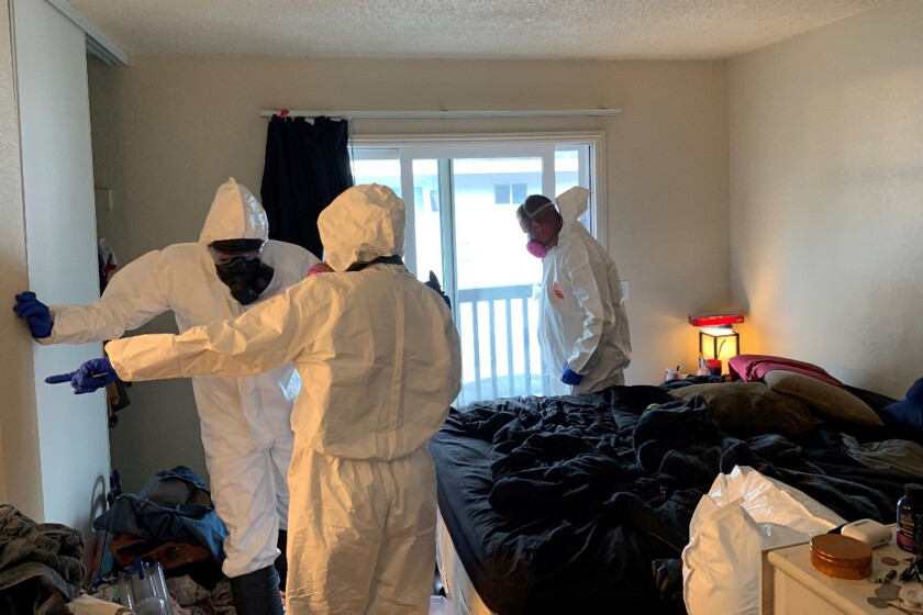 In this photo released by the Santa Rosa Police Department, investigators collect evidence from the home of Evan Frostick, 26, and Madison Bernard, 23, the parents of a 15-month-old toddler found unresponsive in a bedroom in Santa Rosa, Calif., Monday, May 9, 2022. The toddler later died at a hospital and her parents were arrested on suspicion of child abuse after police said they found drug paraphernalia and fentanyl in the family's apartment. (Santa Rosa Police Department via AP)