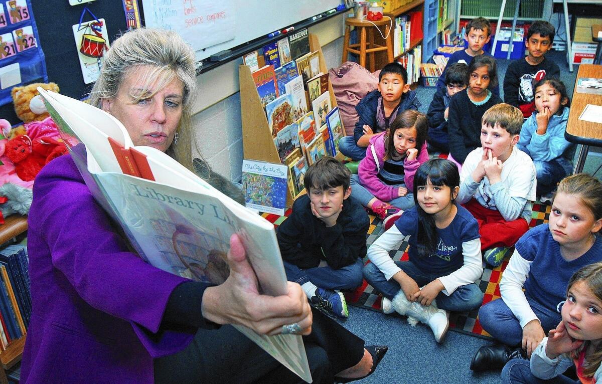 La Cañada School District Superintendent Wendy Sinnette reads "Library Lion" to Mrs. Pruden's third grade class as part of the Dr. Seuss Read Across America at La Cañada Elementary on Friday, Feb. 28, 2014.