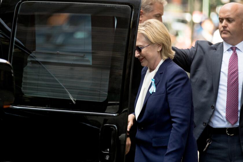 Hillary Clinton gets into a van as she departs a New York apartment building on Sept. 11. Clinton's campaign said the Democratic presidential nominee left a 9/11 anniversary ceremony in New York early after feeling "overheated."