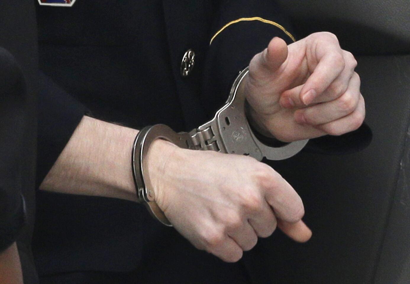 Manning handcuffed