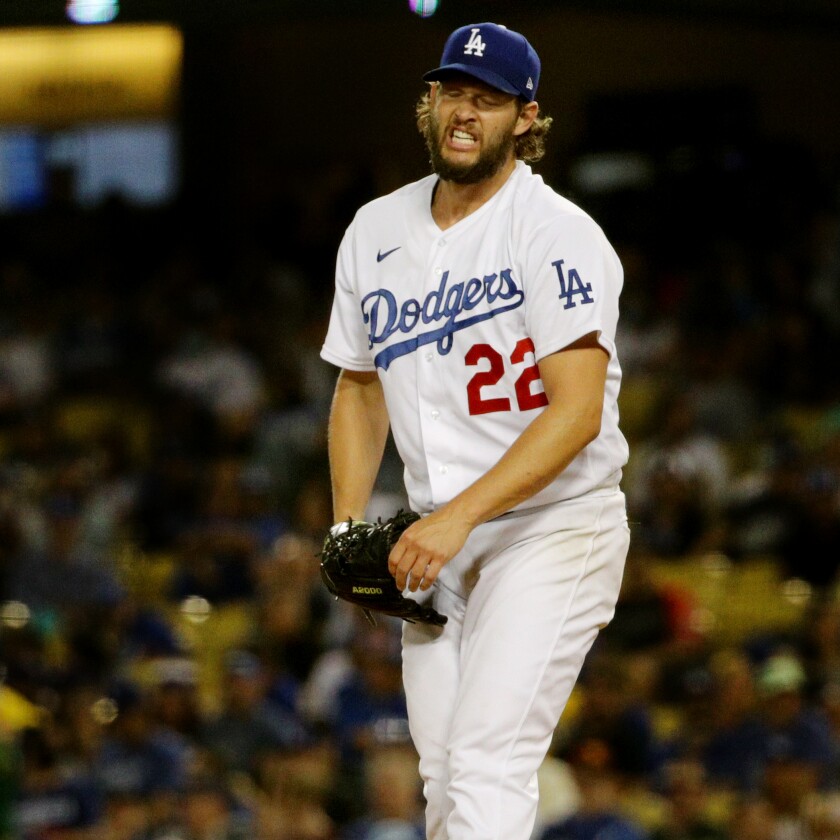 Dodgers starting pitcher Clayton Kershaw grimaces after throwing a pitch