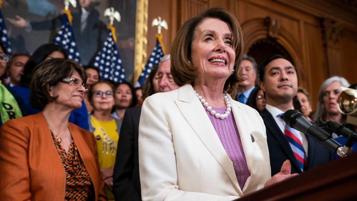 Speaker of the House Nancy Pelosi, along with other Democratic representatives, speaks to the media about the American Dream and Promise Act on Tuesday.