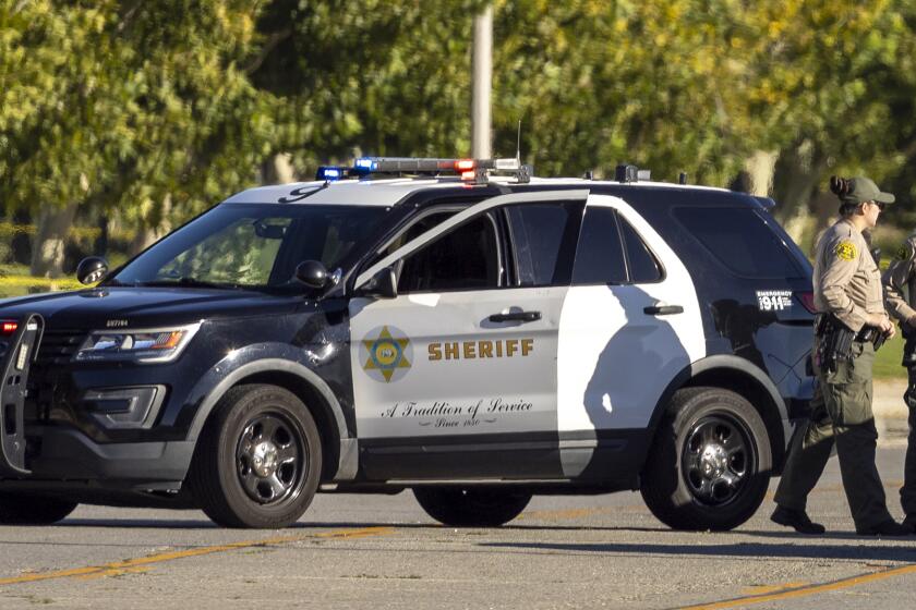 Palmdale, CA - September 17: Los Angeles County Sheriff's deputies secure the scene Sunday morning where an on-duty Los Angeles County sheriff's deputy was shot and killed in a patrol vehicle near the Palmdale Los Angeles County Sheriff Station on Sierra Highway Saturday night in Palmdale Sunday, Sept. 17, 2023. (Allen J. Schaben / Los Angeles Times)