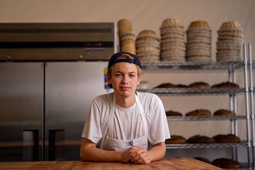 Jyan Isaac poses for a portrait in his shops kitchen in Culver City.