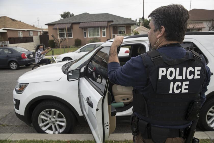 MONTEBELLO, CALIF. -- TUESDAY, APRIL 18, 2017: A Immigration and Customs Enforcement fugitive operations team member Jorge Field outside the Montebello home of a 47-year-old Mexican national in Montebello, Calif., on April 18, 2017. The man refused to come out and the team left. (Brian van der Brug / Los Angeles Times)