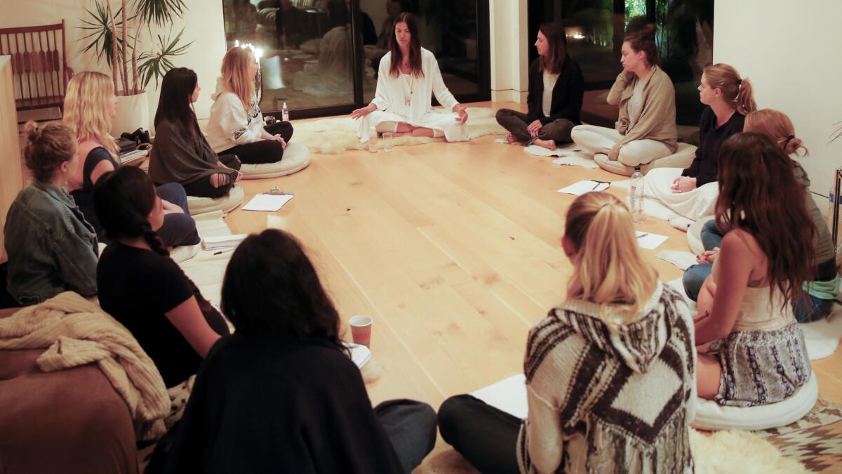 A group of women gather in the Venice home of Paula Mallis for a "New Moon" ceremony.