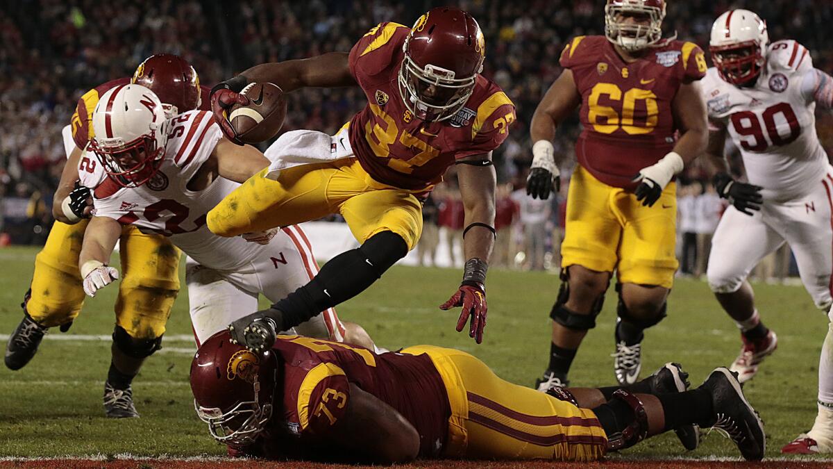 USC running back Javorius Allen leaps into the end zone for a second-quarter touchdown during the Trojans' win over Nebraska in the Holiday Bowl on Dec. 27.