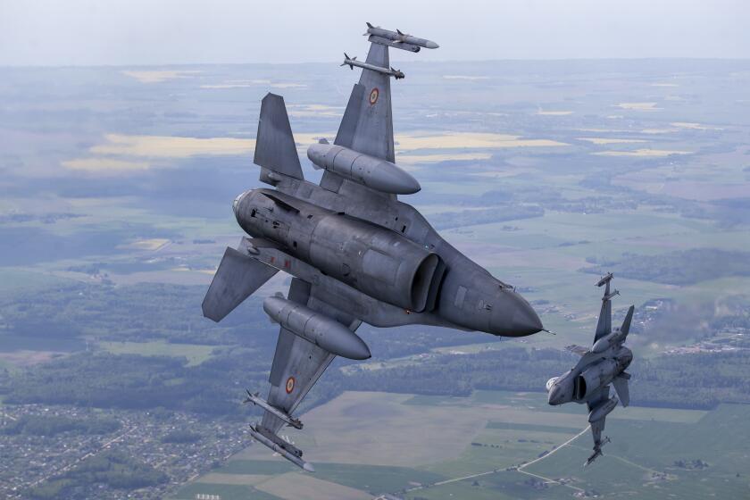 Portuguese Air Force F- 16 military fighter jets participating in NATO's Baltic Air Policing Mission operates in Lithuanian airspace, Monday, May 22, 2023. (AP Photo/Mindaugas Kulbis)