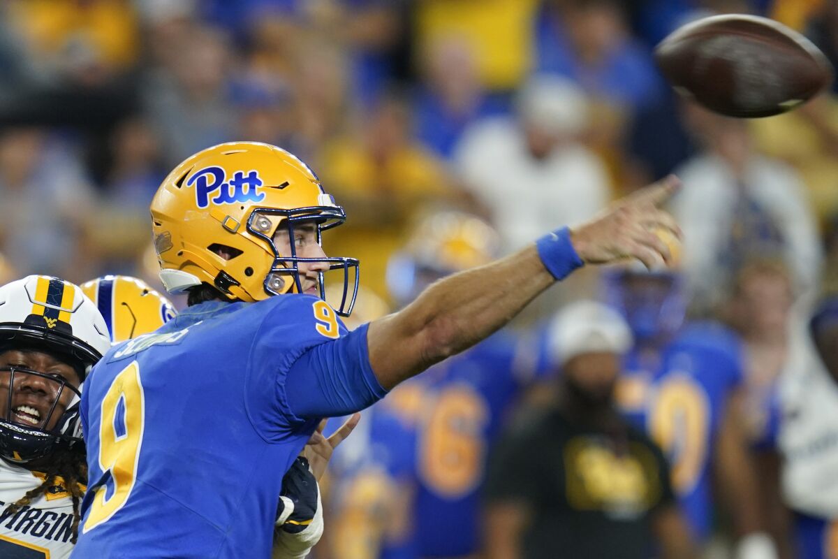 Pittsburgh quarterback Kedon Slovis throws against West Virginia on Sept. 1, 2022.
