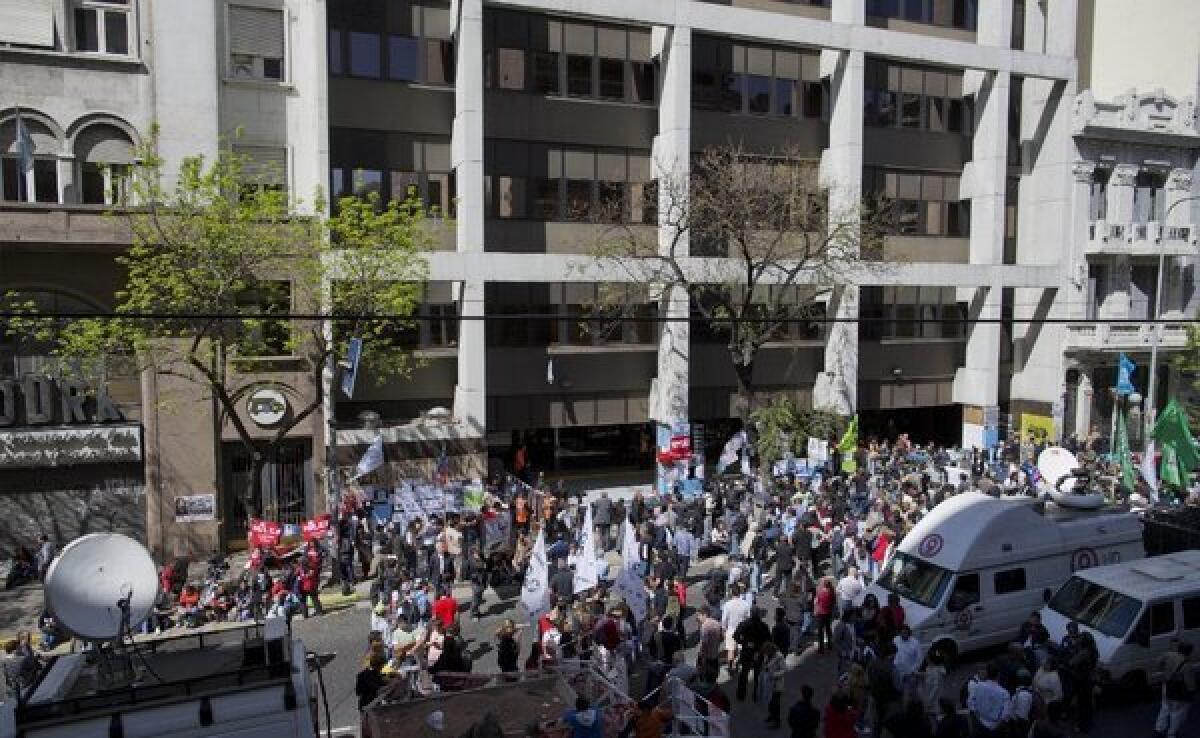 Supporters of Argentina's President Cristina Fernandez gather outside the hospital in Buenos Aires where she underwent surgery Tuesday to remove blood that had collected outside her brain.