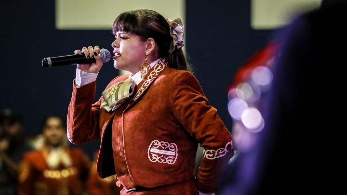 Josie Borges doesn't speak Spanish, but her father translates the mariachi lyrics to help her understand their meaning.