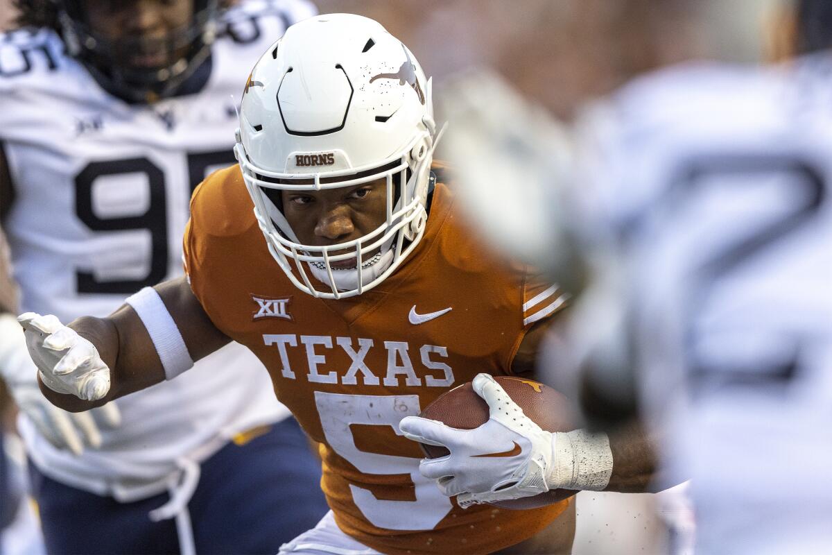 Texas running back Bijan Robinson carries the ball against West Virginia on Oct. 1.