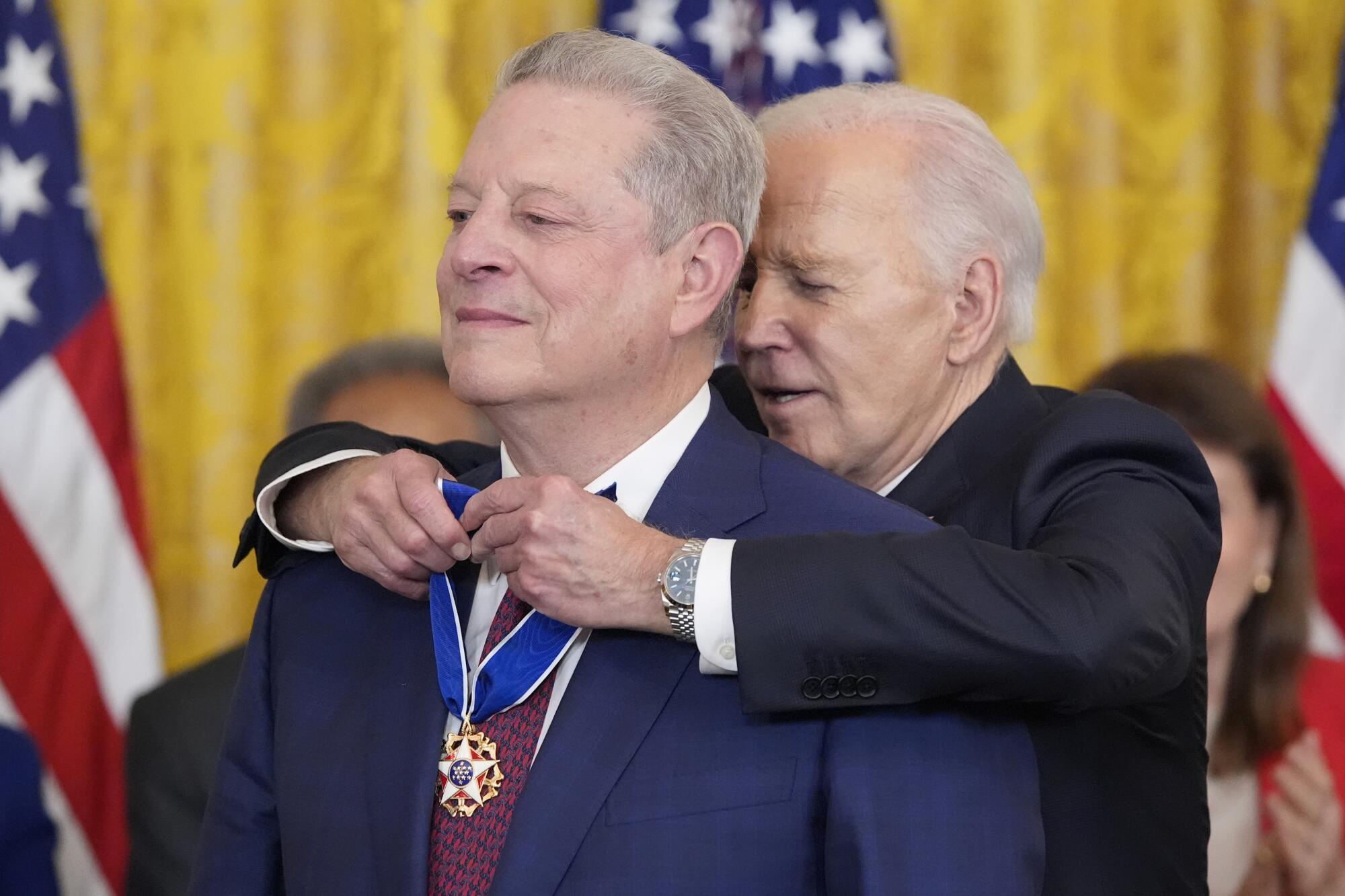 President Biden putting the Presidential Medal of Freedom around the neck of former Vice President Al Gore.