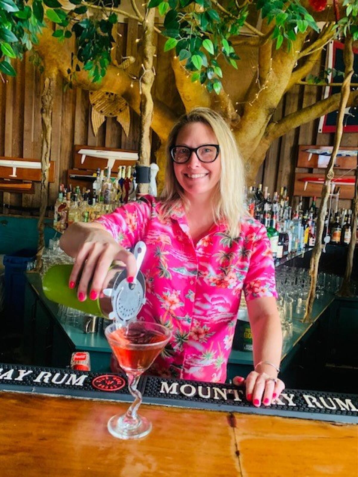 Alexandra Holden tends bar at Fiddler's Green.