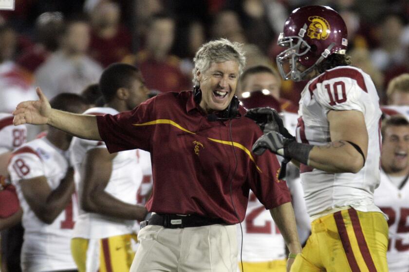 Then-USC Coach Pete Carroll and Brian Cushing celebrate toward the end of the Trojans' 32-18 victory over Michigan in the Jan. 1, 2007 Rose Bowl.