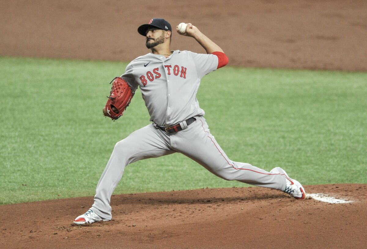 Boston Red Sox starter Martin Perez pitches against the Tampa Bay Rays during the first inning of a baseball game Wednesday, Aug. 5, 2020, in St. Petersburg, Fla. (AP Photo/Steve Nesius)